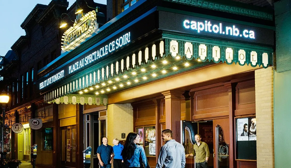 a sunflower in a field with a blue sky in the background